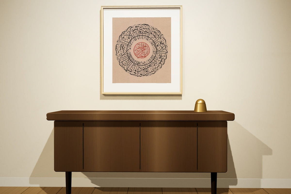 «فنادى في الظلمات», a Thuluth original by Anwar Alhulwani, shown framed in oak above a sideboard (room scene)