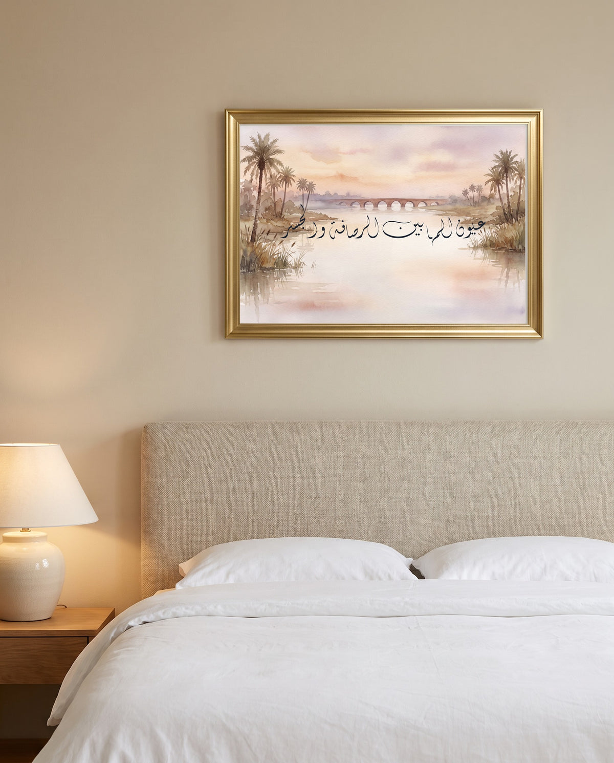 Eyes of the Oryx Between al-Rusafa and the Bridge: Arabic poetry in Diwani calligraphy, framed in polished gold above a bed with white linen