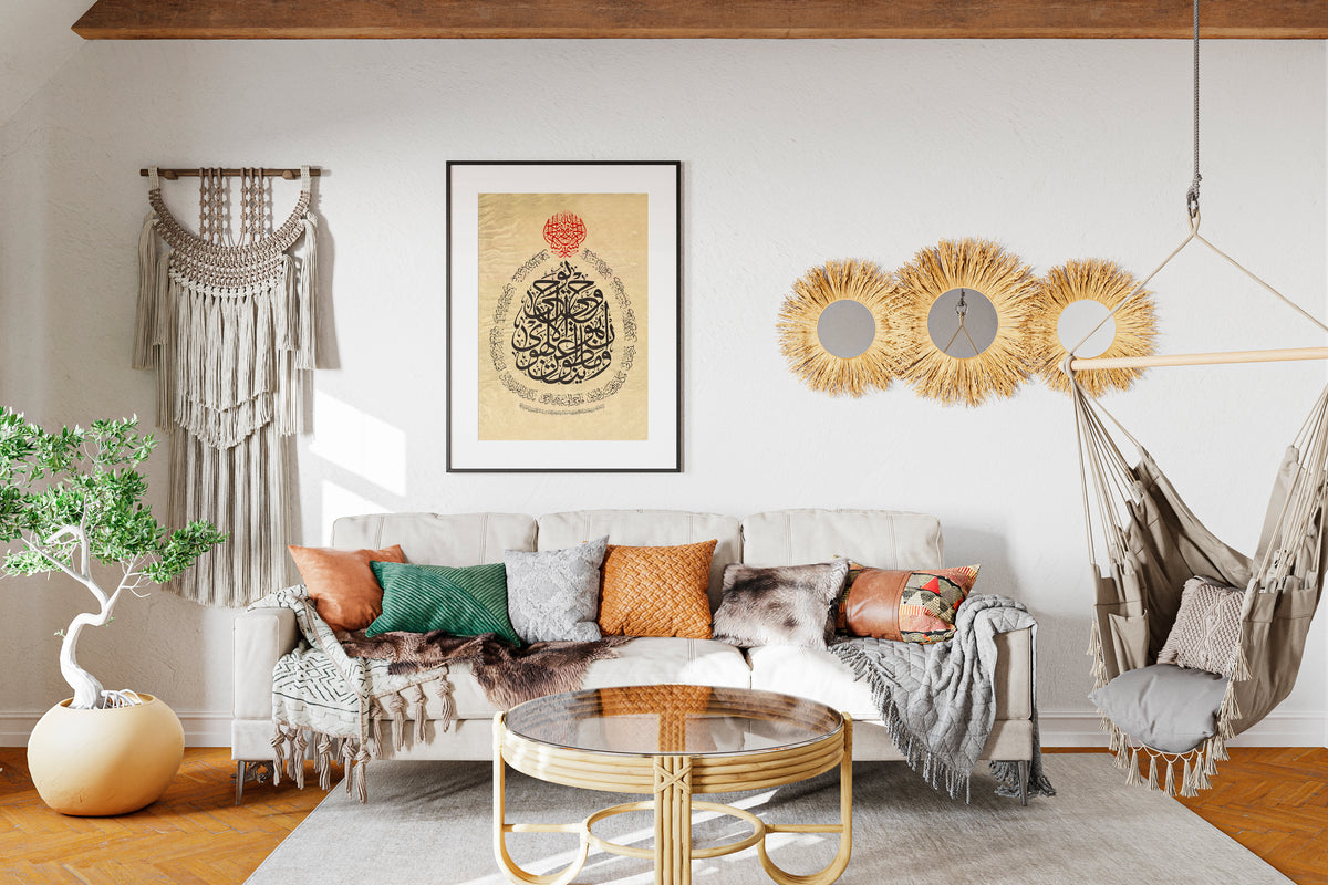 Framed Arabic calligraphy above a sofa in a living room with macramé wall hangings