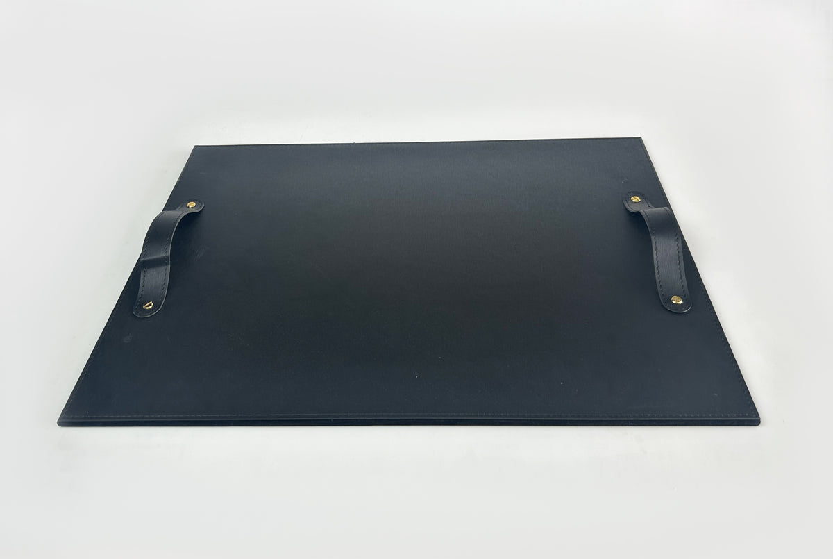 Black leather serving tray with stitched handles, seen from above