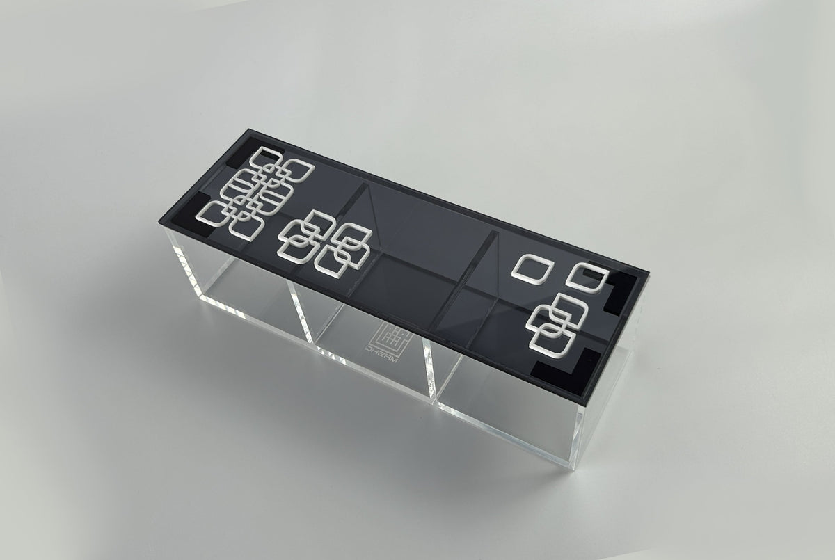 Compact black acrylic box with a white arabesque flower lid for small spaces, by MASHQ