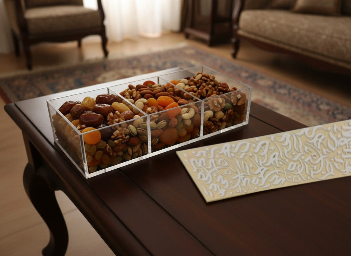 Ramadan in hotels: a Sunbuli calligraphy dates box open on an iftar table with dates, apricots and nuts