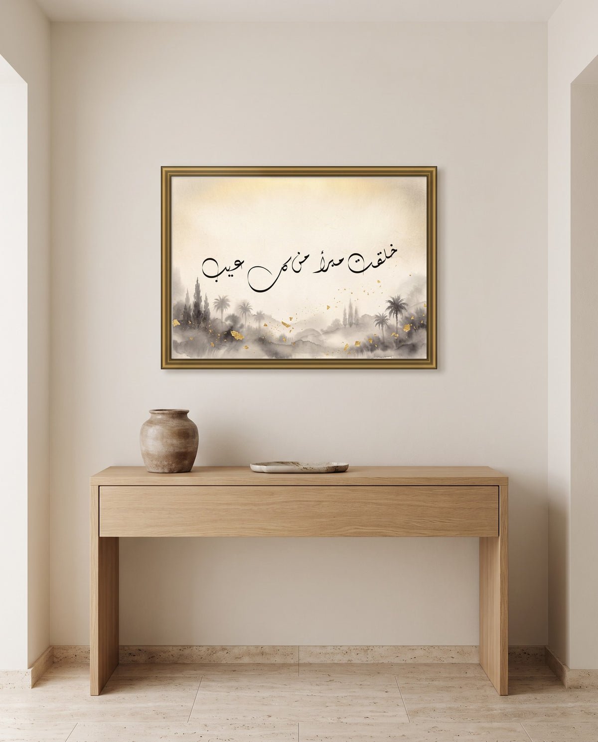 You Were Created Free of Every Flaw: Arabic poetry in Diwani calligraphy, framed in polished gold above an oak console in an entrance hall