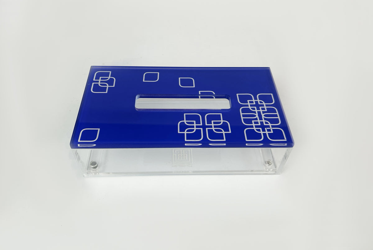 Blue tissue box lid with white square motifs on a clear acrylic base
