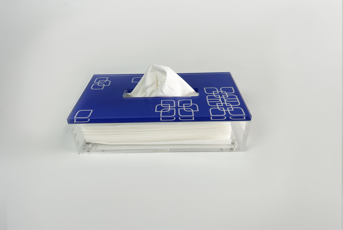 Blue patterned tissue box lid with a tissue drawn through the slot