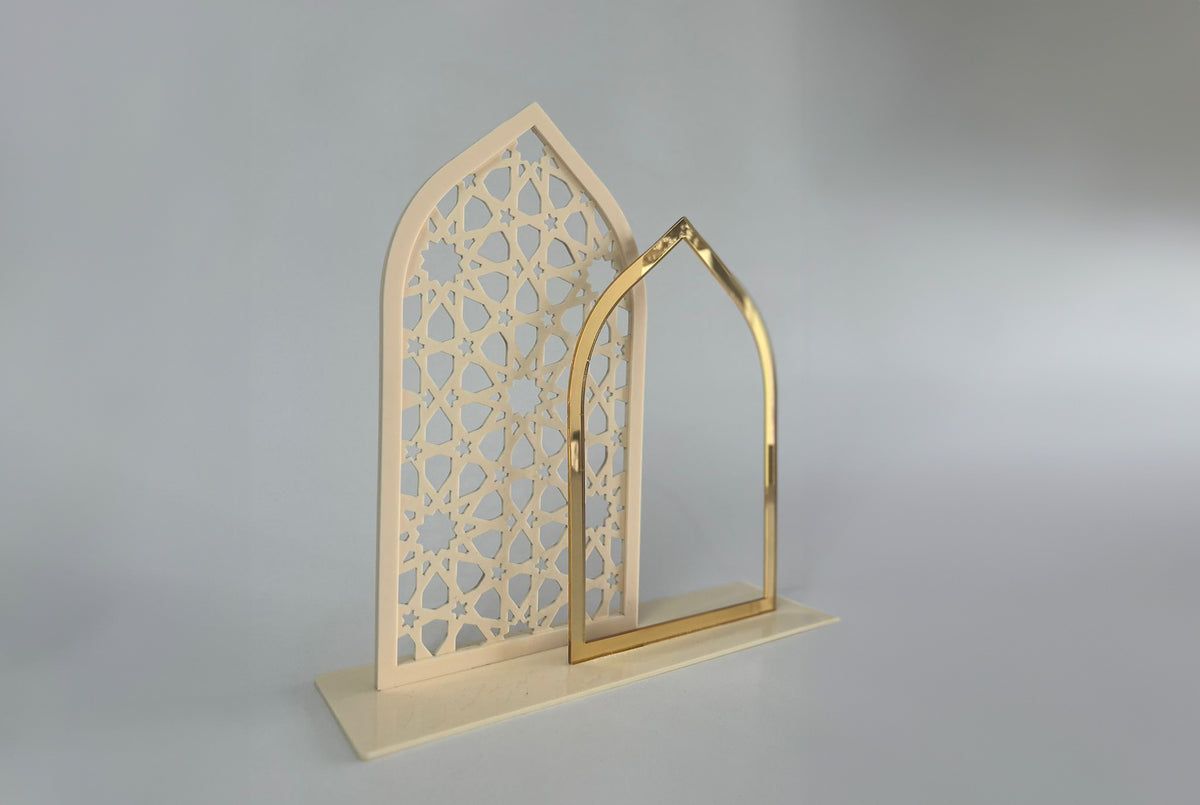 Cream mashrabiya arch panel with a gold arch standing in front of it