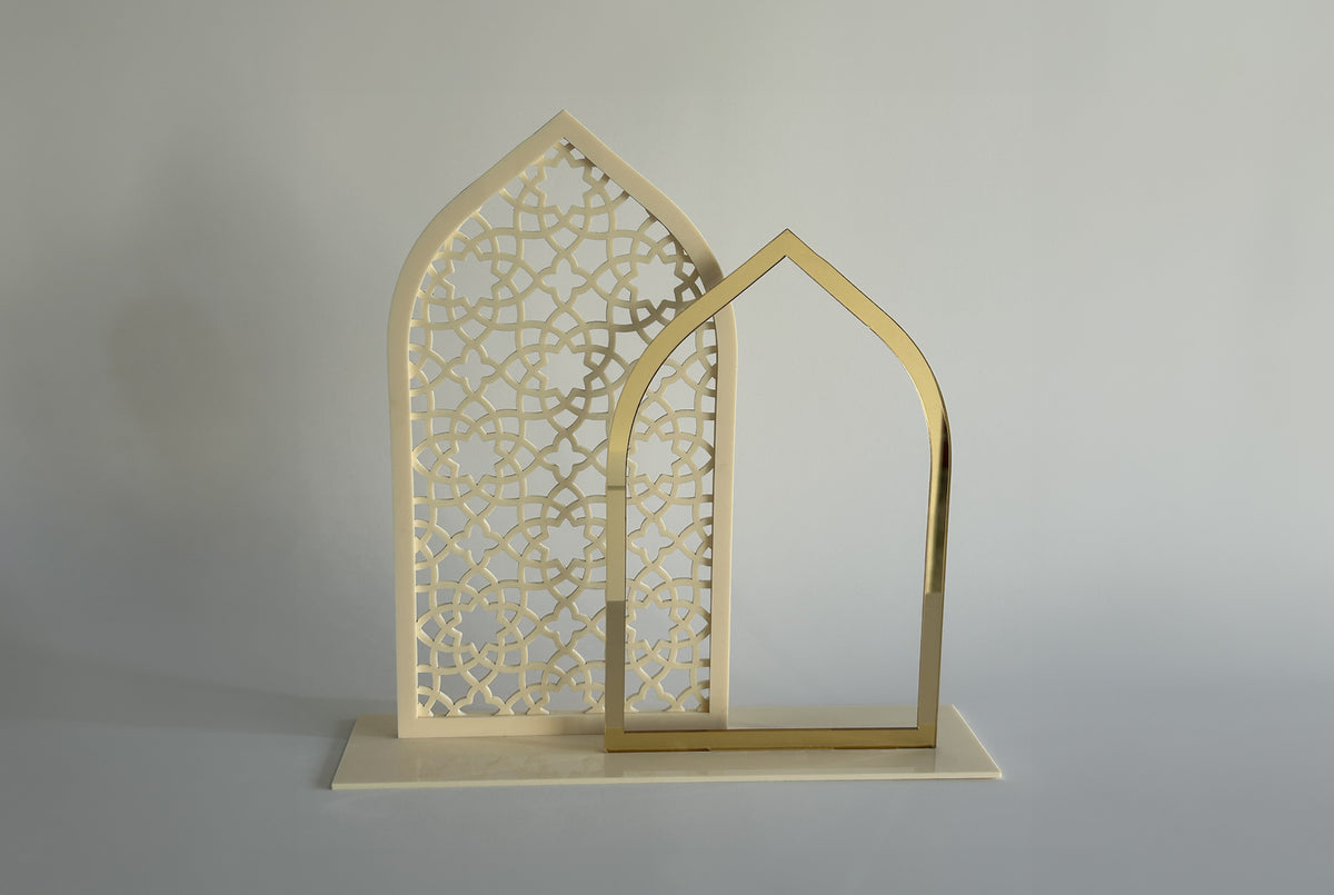 Cream mashrabiya arch panel and gold arch, seen from an angle