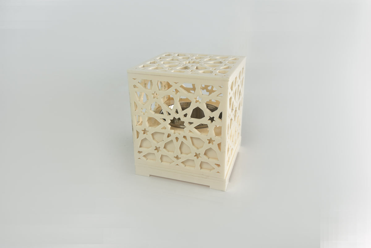 Cream cube censer pierced with an arabesque lattice