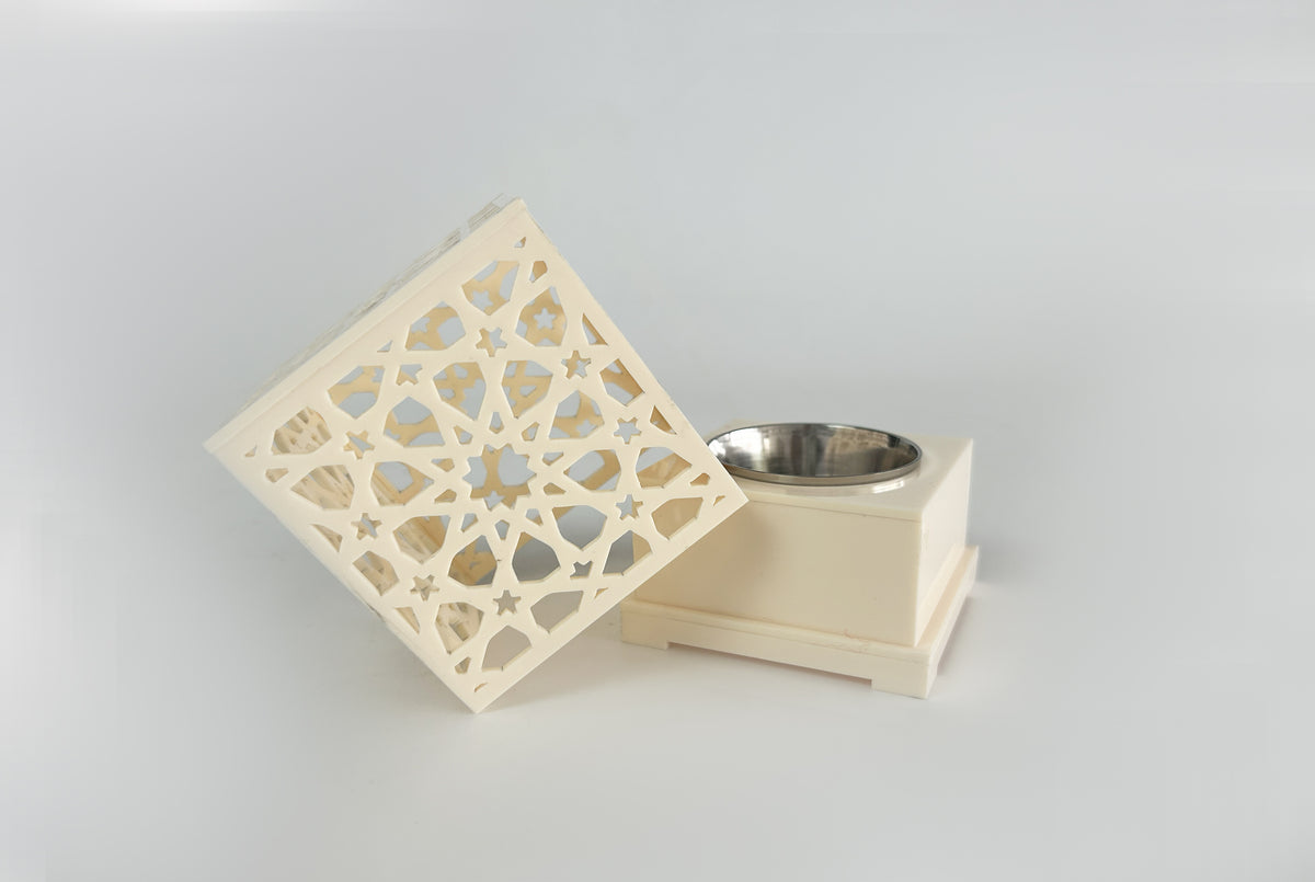 Cream censer with the lid lifted, showing the metal bowl inside