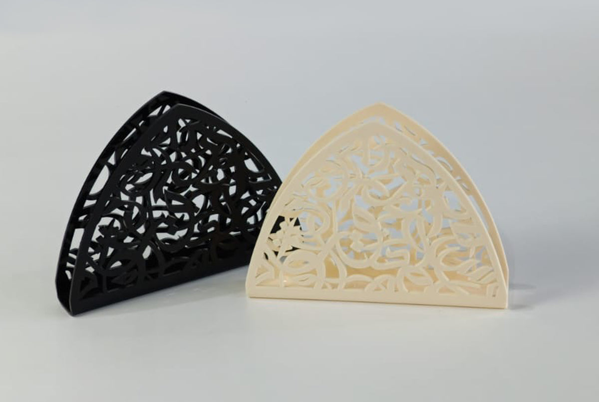 Black and cream arabesque napkin holders side by side