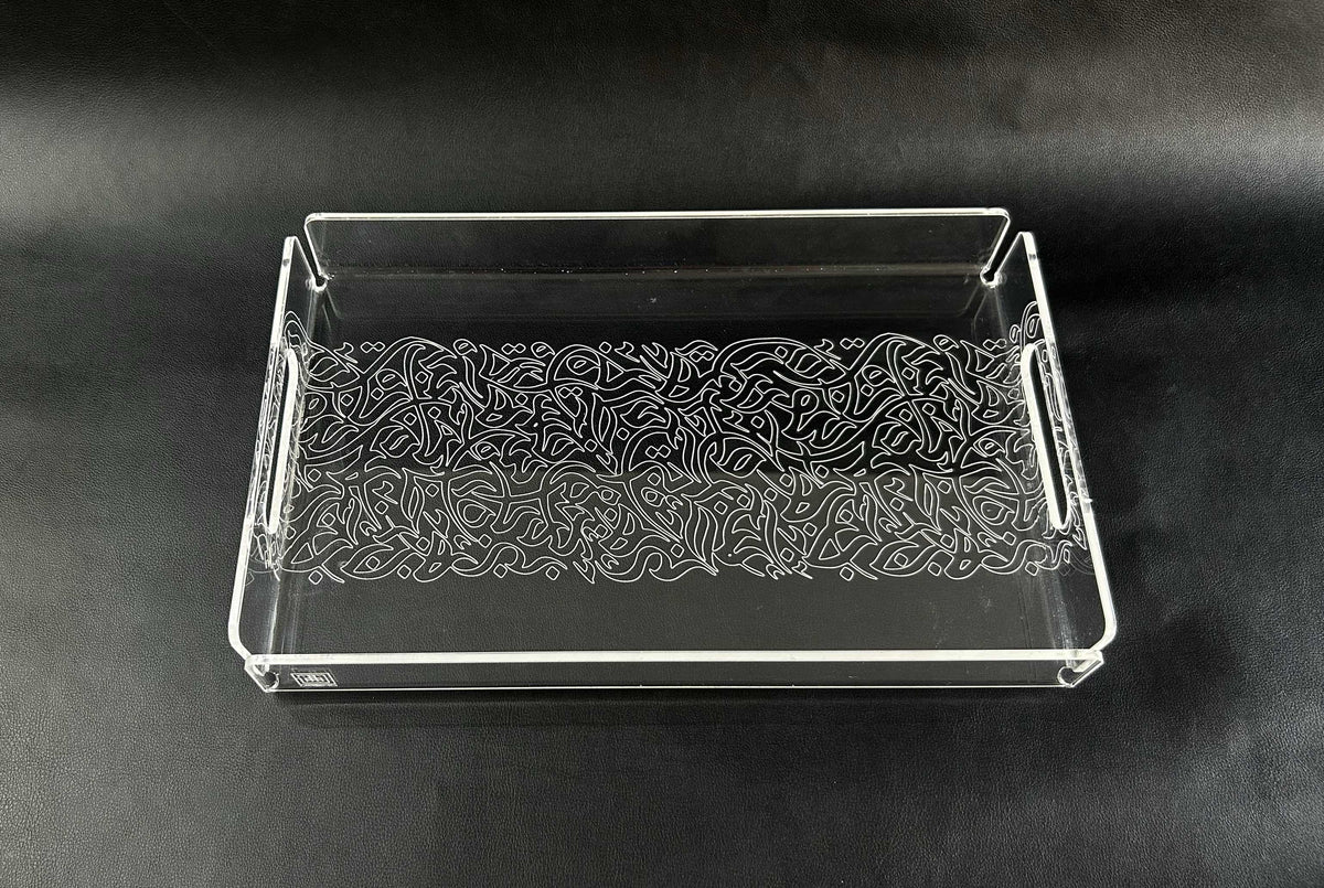 Clear acrylic tray with engraved calligraphy filling the base